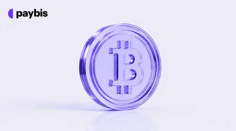 Translucent purple Bitcoin coin with the Paybis logo on a pale lavender background.